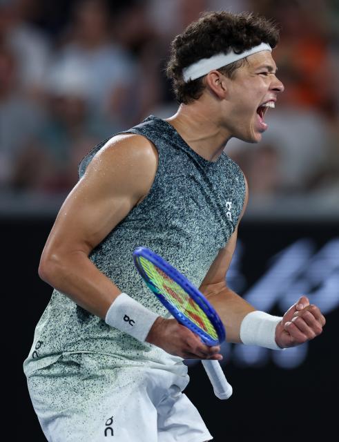 (260124) -- MELBOURNE, Jan. 24, 2026 (Xinhua) -- Ben Shelton of the United States celebrates after winning the men's singles 3rd round match against Valentin Vacherot of Monaco at the Australian Open 2026 tennis tournament in Melbourne, Australia, Jan. 24, 2026. (Xinhua/Ma Ping)