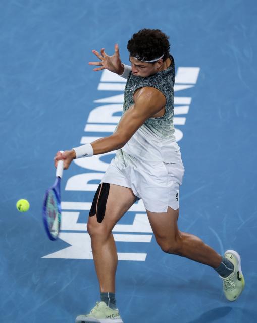 (260124) -- MELBOURNE, Jan. 24, 2026 (Xinhua) -- Ben Shelton of the United States hits a return during the men's singles 3rd round match against Valentin Vacherot of Monaco at the Australian Open 2026 tennis tournament in Melbourne, Australia, Jan. 24, 2026. (Xinhua/Ma Ping)