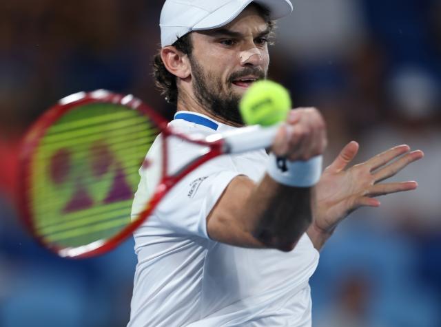(260124) -- MELBOURNE, Jan. 24, 2026 (Xinhua) -- Valentin Vacherot of Monaco hits a return during the men's singles 3rd round match against Ben Shelton of the United States at the Australian Open 2026 tennis tournament in Melbourne, Australia, Jan. 24, 2026. (Xinhua/Ma Ping)