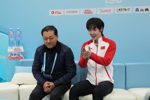 (260124) -- BEIJING, Jan. 24, 2026 (Xinhua) -- Jin Boyang (R) of China reacts after the men's short program at the ISU Four Continents Figure Skating Championships in Beijing, China, Jan. 24, 2026. (Xinhua/Xie Han)