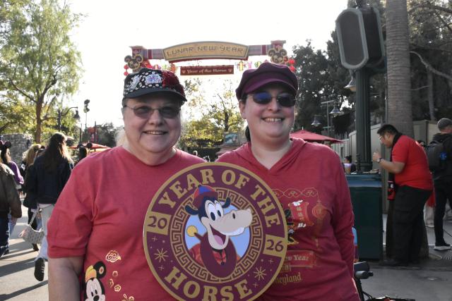 (260124) -- ANAHEIM, Jan. 24, 2026 (Xinhua) -- Visitors display a placard welcoming the Year of the Horse during the Lunar New Year celebrations at Disney California Adventure Park in Anaheim, California, the United States, Jan. 23, 2026. Disneyland Resort kicked off its annual Lunar New Year celebrations on Friday, transforming the park into a vibrant showcase of Asian cultures, cuisine and traditions that continues to attract growing interest from U.S. visitors.
   TO GO WITH "Feature: Disneyland's Lunar New Year celebrations offer immersive window into Asian cultures" (Photo by Zeng Hui/Xinhua)