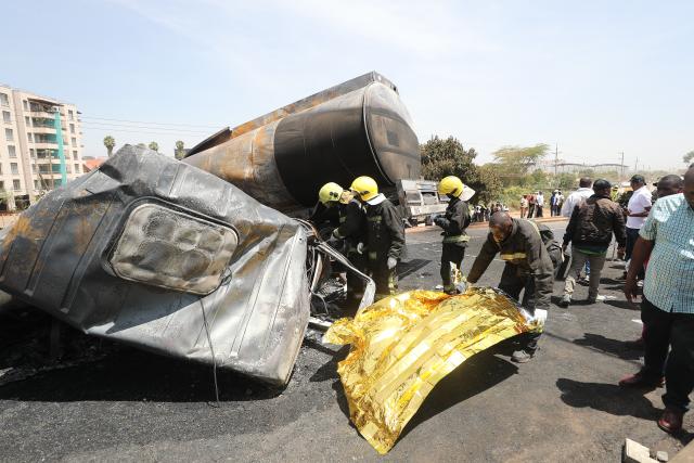 (260124) -- NAIROBI, Jan. 24, 2026 (Xinhua) -- Emergency workers work at the site of an oil tanker explosion in Nairobi, the capital of Kenya, Jan. 24, 2026. At least one person killed after an oil tanker collided with a truck and exploded on a road near Wilson Airport in Nairobi, Kenya, local media reported. (Photo by Henry Naminde/Xinhua)