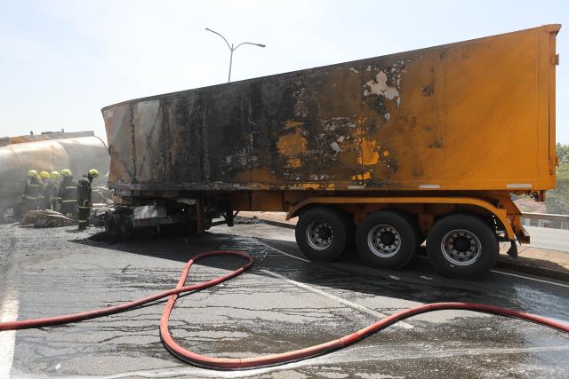 (260124) -- NAIROBI, Jan. 24, 2026 (Xinhua) -- This photo taken on Jan. 24, 2026 shows the site of an oil tanker explosion in Nairobi, the capital of Kenya. At least one person killed after an oil tanker collided with a truck and exploded on a road near Wilson Airport in Nairobi, Kenya, local media reported. (Photo by Henry Naminde/Xinhua)