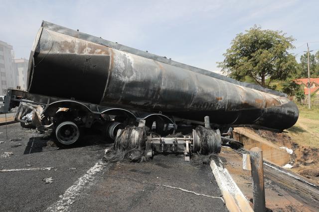 (260124) -- NAIROBI, Jan. 24, 2026 (Xinhua) -- This photo taken on Jan. 24, 2026 shows the site of an oil tanker explosion in Nairobi, the capital of Kenya. At least one person killed after an oil tanker collided with a truck and exploded on a road near Wilson Airport in Nairobi, Kenya, local media reported. (Photo by Henry Naminde/Xinhua)