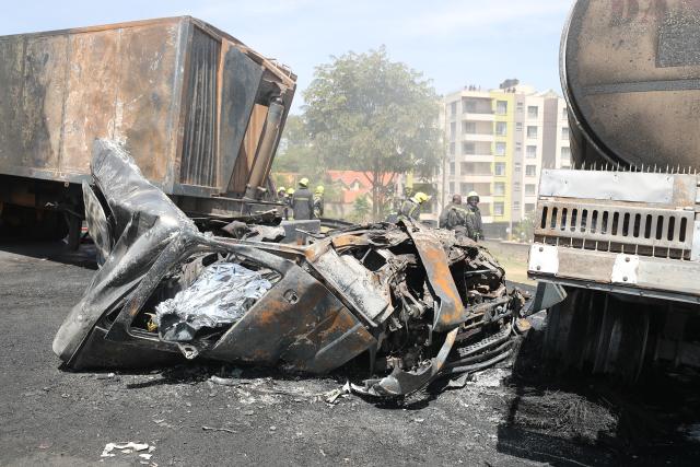 (260124) -- NAIROBI, Jan. 24, 2026 (Xinhua) -- This photo taken on Jan. 24, 2026 shows the site of an oil tanker explosion in Nairobi, the capital of Kenya. At least one person killed after an oil tanker collided with a truck and exploded on a road near Wilson Airport in Nairobi, Kenya, local media reported. (Photo by Henry Naminde/Xinhua)