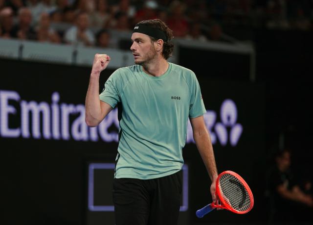 (260124) -- MELBOURNE, Jan. 24, 2026 (Xinhua) -- Taylor Fritz celebrates scoring during the men's singles 3rd round match between Taylor Fritz of the United States and Stan Wawrinka of Switzerland at the Australian Open tennis tournament in Melbourne, Australia, Jan. 24, 2026. (Photo by Wang Shen/Xinhua)