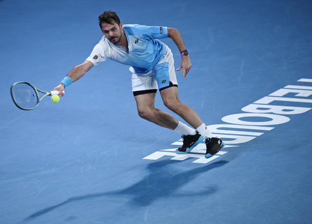 (260124) -- MELBOURNE, Jan. 24, 2026 (Xinhua) -- Stan Wawrinka hits a return during the men's singles 3rd round match between Taylor Fritz of the United States and Stan Wawrinka of Switzerland at the Australian Open tennis tournament in Melbourne, Australia, Jan. 24, 2026. (Photo by Wang Shen/Xinhua)