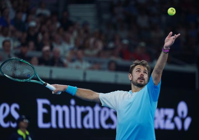 (260124) -- MELBOURNE, Jan. 24, 2026 (Xinhua) -- Stan Wawrinka serves during the men's singles 3rd round match between Taylor Fritz of the United States and Stan Wawrinka of Switzerland at the Australian Open tennis tournament in Melbourne, Australia, Jan. 24, 2026. (Photo by Wang Shen/Xinhua)