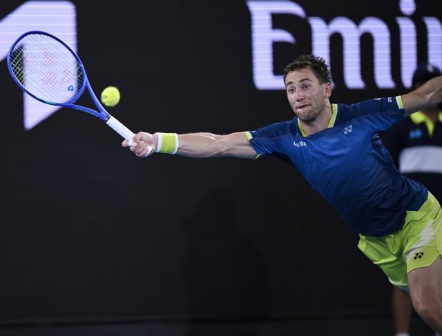 (260124) -- MELBOURNE, Jan. 24, 2026 (Xinhua) -- Casper Ruud hits a return during the men's singles 3rd round match between Marin Cilic of Croatia and Casper Ruud of Norway at the Australian Open tennis tournament in Melbourne, Australia, Jan. 24, 2026. (Photo by Wang Shen/Xinhua)