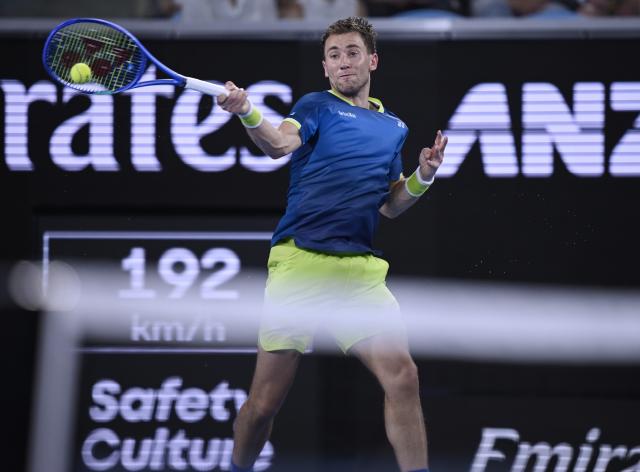 (260124) -- MELBOURNE, Jan. 24, 2026 (Xinhua) -- Casper Ruud hits a return during the men's singles 3rd round match between Marin Cilic of Croatia and Casper Ruud of Norway at the Australian Open tennis tournament in Melbourne, Australia, Jan. 24, 2026. (Photo by Wang Shen/Xinhua)