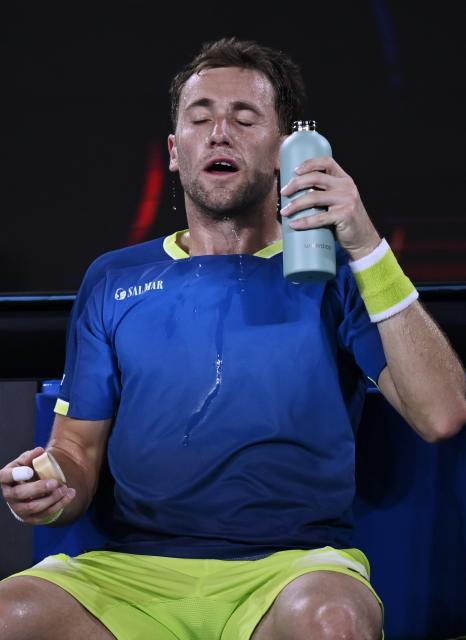 (260124) -- MELBOURNE, Jan. 24, 2026 (Xinhua) -- Casper Ruud cools down during the men's singles 3rd round match between Marin Cilic of Croatia and Casper Ruud of Norway at the Australian Open tennis tournament in Melbourne, Australia, Jan. 24, 2026. (Photo by Wang Shen/Xinhua)