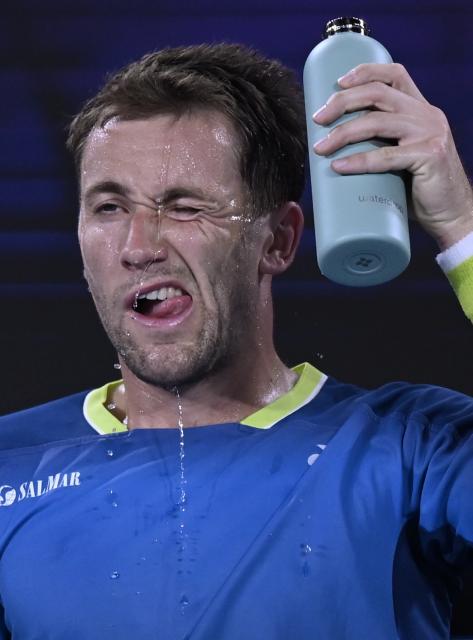 (260124) -- MELBOURNE, Jan. 24, 2026 (Xinhua) -- Casper Ruud cools down during the men's singles 3rd round match between Marin Cilic of Croatia and Casper Ruud of Norway at the Australian Open tennis tournament in Melbourne, Australia, Jan. 24, 2026. (Photo by Wang Shen/Xinhua)
