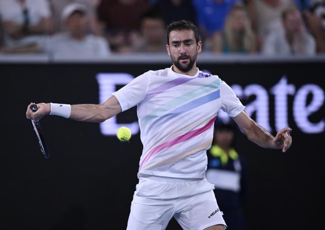 (260124) -- MELBOURNE, Jan. 24, 2026 (Xinhua) -- Marin Cilic hits a return during the men's singles 3rd round match between Marin Cilic of Croatia and Casper Ruud of Norway at the Australian Open tennis tournament in Melbourne, Australia, Jan. 24, 2026. (Photo by Wang Shen/Xinhua)