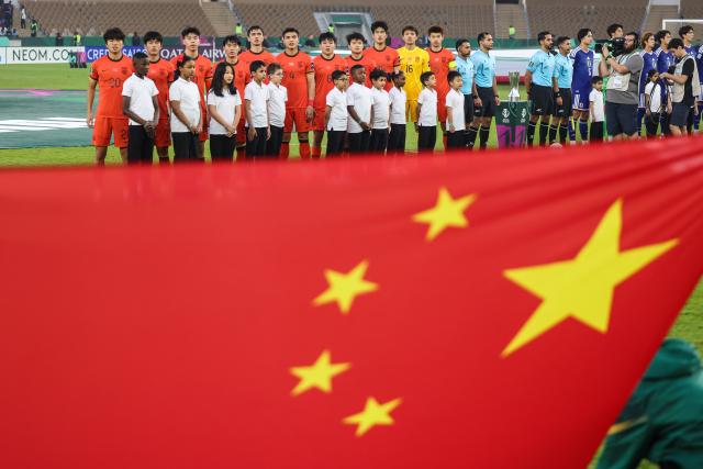 (260124) -- JEDDAH, Jan. 24, 2026 (Xinhua) -- China's starting players line up for the national anthem before the 2026 AFC U23 Asian Cup final match between China and Japan in Jeddah, Saudi Arabia, Jan. 24, 2026. (Xinhua/Wang Haizhou)