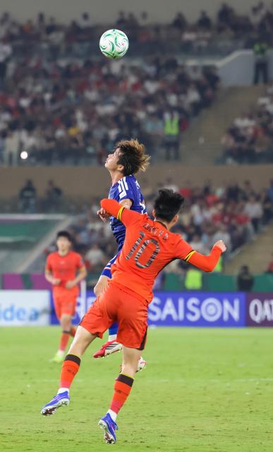 (260124) -- JEDDAH, Jan. 24, 2026 (Xinhua) -- Wang Yudong (front) of China heads for the ball during the 2026 AFC U23 Asian Cup final match between China and Japan in Jeddah, Saudi Arabia, Jan. 24, 2026. (Xinhua/Wang Haizhou)