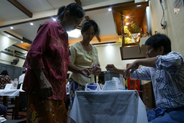 (260125) -- YANGON, Jan. 25, 2026 (Xinhua) -- A voter has her finger marked with ink at a polling station in Yangon, Myanmar, Jan. 25, 2026. The final phase of Myanmar's multi-party democratic general election began on Sunday morning, with polling stations opening in about 60 townships. (Xinhua/Myo Kyaw Soe)