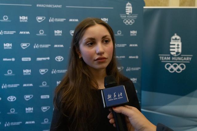 (260125) -- BUDAPEST, Jan. 25, 2026 (Xinhua) -- Maja Somodi, Hungarian short track speed skater, receives an interview during an oath-taking ceremony for the upcoming Milan-Cortina 2026 Winter Olympic Games in Budapest, Hungary, on Jan. 24, 2026. (Photo by Attila Volgyi/Xinhua)