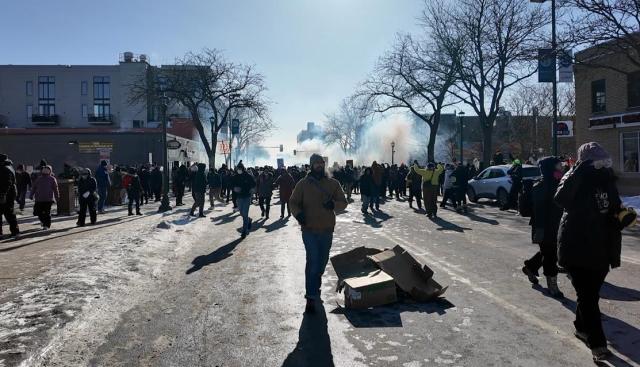 (260125) -- MINNEAPOLIS, Jan. 25, 2026 (Xinhua) -- This photo taken with a mobile phone shows people attending a protest in Minneapolis, Minnesota, the United States, on Jan. 24, 2026. A man was shot and killed by federal agents in Minneapolis, the largest city in the U.S. state of Minnesota, on Saturday morning, authorities said.
   This incident marks the third shooting involving federal law enforcement officers in the city this month. (Xinhua)