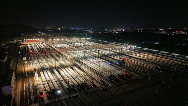 (260125) -- KUNMING, Jan. 25, 2026 (Xinhua) -- An aerial drone photo taken on Jan. 25, 2026 shows the bullet trains at a depot in Kunming, southwest China's Yunnan Province. A new train schedule will be put into effect in China from Jan. 26. 2026. (Photo by Yang Zixuan/Xinhua)
