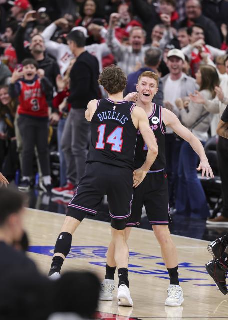 (260125) -- CHICAGO, Jan. 25, 2026 (Xinhua) -- Chicago Bulls' Kevin Huerter (R) celebrates his game winning shot with teammate Matas Buzelis during the 2025-2026 NBA regular season basketball game between Boston Celtics and Chicago Bulls in Chicago, the United States, Jan. 24, 2026. (Photo by Joel Lerner/Xinhua)