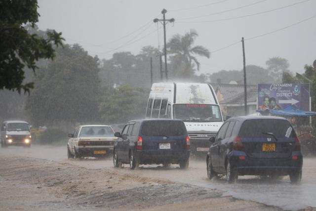 (260125) -- HARARE, Jan. 25, 2026 (Xinhua) -- Cars drive in heavy rain in Harare, Zimbabwe, Jan. 24, 2026. Persistent rains have battered large parts of Zimbabwe in recent months, leaving more than 70 people dead and causing extensive damage to road infrastructure. (Str/Xinhua)
