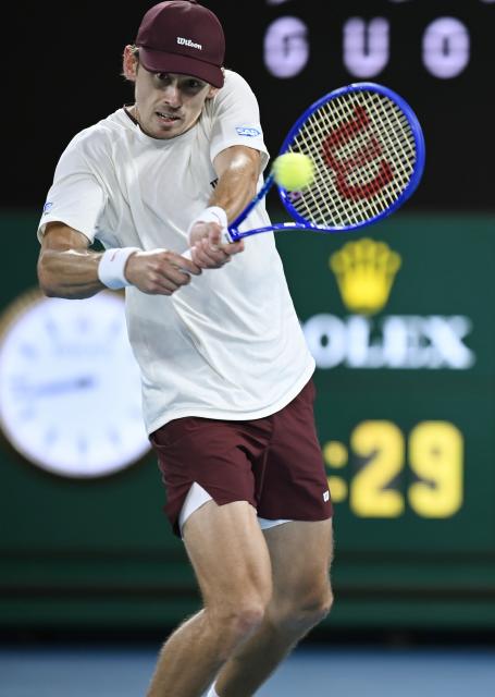 (260125) -- MELBOURNE, Jan. 25, 2026 (Xinhua) -- Alex de Minaur hits a return during the men's singles 4th round match between Alex de Minaur of Australia and Alexander Bublik of Kazakhstan at the Australian Open tennis tournament in Melbourne, Australia, Jan. 25, 2026. (Photo by Wang Shen/Xinhua)