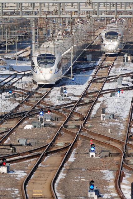 (260125) -- BEIJING, Jan. 25, 2026 (Xinhua) -- Bullet trains are pictured on the Yantai section of Qingdao-Rongcheng Intercity Railway in Yantai, east China's Shandong Province, Jan. 25, 2026. A new train schedule will be put into effect in China from Jan. 26. 2026. (Photo by Tang Ke/Xinhua)