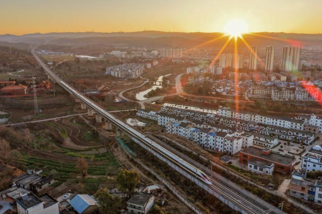 (260125) -- BEIJING, Jan. 25, 2026 (Xinhua) -- A drone photo taken on Jan. 25, 2026 shows a bullet train running in Qujing City, southwest China's Yunnan Province. A new train schedule will be put into effect in China from Jan. 26. 2026. (Photo by Sun Wenlai/Xinhua)