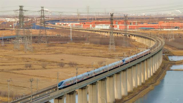 (260125) -- BEIJING, Jan. 25, 2026 (Xinhua) -- A drone photo taken on Jan. 25, 2026 shows a bullet train running in north China's Tianjin Municipality. A new train schedule will be put into effect in China from Jan. 26. 2026. (Photo by Du Penghui/Xinhua)