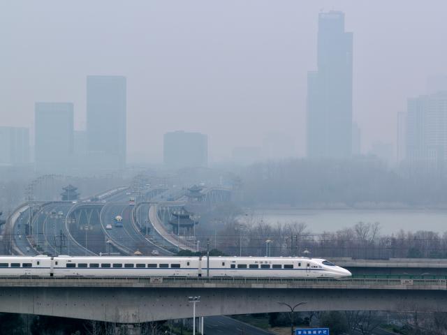 (260125) -- BEIJING, Jan. 25, 2026 (Xinhua) -- A drone photo taken on Jan. 25, 2026 shows a bullet train running in Yangzhou City of east China's Jiangsu Province. A new train schedule will be put into effect in China from Jan. 26. 2026. (Photo by Meng Delong/Xinhua)