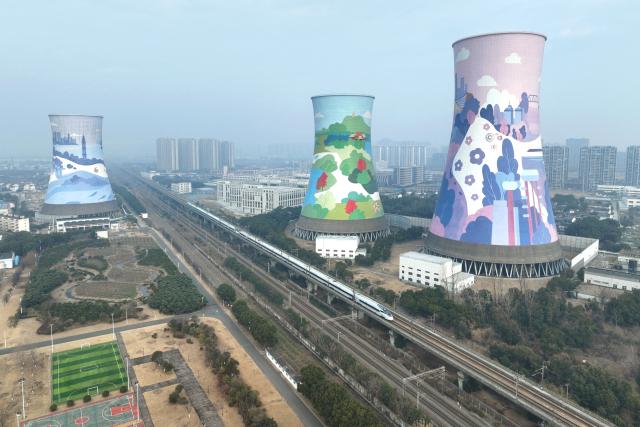 (260125) -- BEIJING, Jan. 25, 2026 (Xinhua) -- A drone photo taken on Jan. 25, 2026 shows a bullet train running in Changzhou City, east China's Jiangsu Province. A new train schedule will be put into effect in China from Jan. 26. 2026. (Photo by Chen Wei/Xinhua)