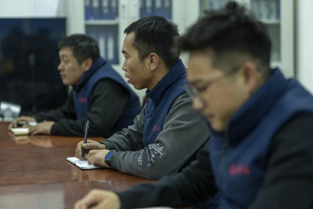 (260125) -- NAGQU, Jan. 25, 2026 (Xinhua) -- Workers attend a summary meeting after work at Za'gya Zangbo signal maintenance section in Amdo County, Nagqu, southwest China's Xizang Autonomous Region, Jan. 23, 2026. Perched at an altitude of 4,886 meters, the Za'gya Zangbo signal maintenance section in Amdo County is the world's highest railway signal maintenance section. Fierce winds and bitter cold prevail in the area, where temperatures often drop below minus 30 degrees Celsius.
   Since its establishment in 2018, the section has been responsible for maintaining and repairing signal equipment at three high-altitude stations -- Tanggula South, Za'gya Zangbo and Xuechama. Ten young workers from various ethnic groups, including the Han, Tibetan and Mongolian, are currently on duty here. With an average age of under 32, they brave extreme conditions to keep the railway operating safely, ensuring the smooth flow of trains during the upcoming Spring Festival travel rush and the long term. (Xinhua/Tenzing Nima Qadhup)