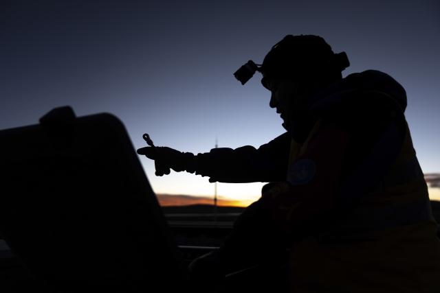 (260125) -- NAGQU, Jan. 25, 2026 (Xinhua) -- A worker checks the internal wiring of a track circuit box in Amdo County, Nagqu, southwest China's Xizang Autonomous Region, Jan. 23, 2026. Perched at an altitude of 4,886 meters, the Za'gya Zangbo signal maintenance section in Amdo County is the world's highest railway signal maintenance section. Fierce winds and bitter cold prevail in the area, where temperatures often drop below minus 30 degrees Celsius.
   Since its establishment in 2018, the section has been responsible for maintaining and repairing signal equipment at three high-altitude stations -- Tanggula South, Za'gya Zangbo and Xuechama. Ten young workers from various ethnic groups, including the Han, Tibetan and Mongolian, are currently on duty here. With an average age of under 32, they brave extreme conditions to keep the railway operating safely, ensuring the smooth flow of trains during the upcoming Spring Festival travel rush and the long term. (Xinhua/Tenzing Nima Qadhup)