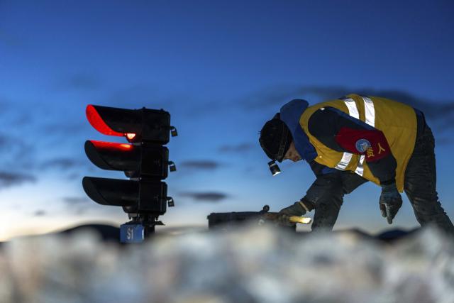 (260125) -- NAGQU, Jan. 25, 2026 (Xinhua) -- A worker conducts daily maintenance on a signal machine in Amdo County, Nagqu, southwest China's Xizang Autonomous Region, Jan. 23, 2026. Perched at an altitude of 4,886 meters, the Za'gya Zangbo signal maintenance section in Amdo County is the world's highest railway signal maintenance section. Fierce winds and bitter cold prevail in the area, where temperatures often drop below minus 30 degrees Celsius.
   Since its establishment in 2018, the section has been responsible for maintaining and repairing signal equipment at three high-altitude stations -- Tanggula South, Za'gya Zangbo and Xuechama. Ten young workers from various ethnic groups, including the Han, Tibetan and Mongolian, are currently on duty here. With an average age of under 32, they brave extreme conditions to keep the railway operating safely, ensuring the smooth flow of trains during the upcoming Spring Festival travel rush and the long term. (Xinhua/Tenzing Nima Qadhup)