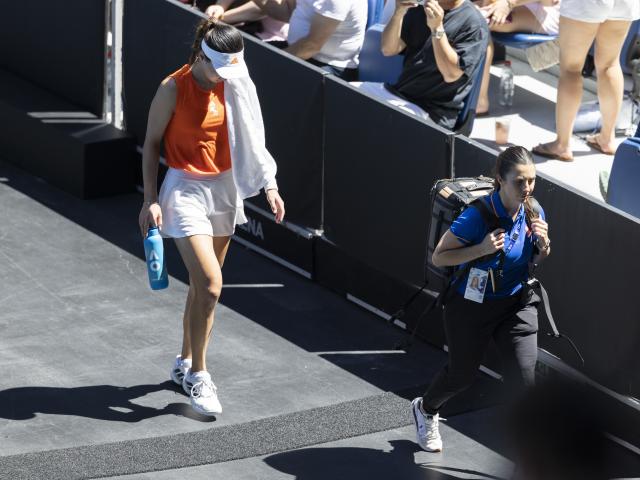 (260126) -- MELBOURNE, Jan. 26, 2026 (Xinhua) -- Wang Xinyu of China reacts at a medical timeout during the women's singles 4th round match between Wang Xinyu of China and Amanda Anisimova of the United States at the Australian Open tennis tournament in Melbourne, Australia, Jan. 26, 2026. (Photo by Hu Jingchen/Xinhua)