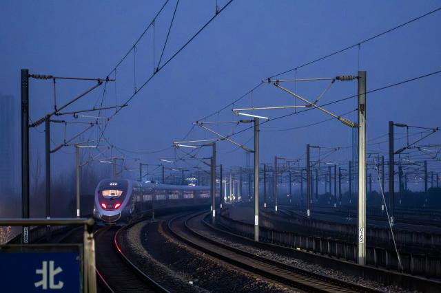 (260126) -- WUHAN, Jan. 26, 2026 (Xinhua) -- A train departs the Wuhan Railway Station in Wuhan, central China's Hubei Province, on Jan. 26, 2026. A new nationwide train schedule has taken effect in China from Jan. 26, 2026 with improved passenger and freight transport capacity and efficiency. (Xinhua/Wu Zhizun)