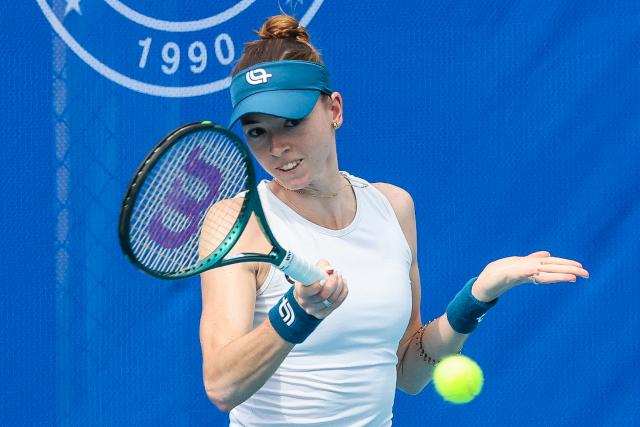 (260126) -- MANILA, Jan. 26, 2026 (Xinhua) -- Simona Waltert hits a return during the women's singles round of 32 match between Lanlana Tararudee of Thailand and Simona Waltert of Switzerland at the WTA Philippine Women's Open in Manila, the Philippines, Jan. 26, 2026. (Xinhua/Rouelle Umali)