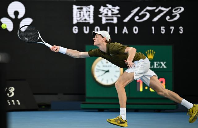 (260126) -- MELBOURNE, Jan. 26, 2026 (Xinhua) -- Jannik Sinner hits a return during the men's singles 4th round match between Luciano Darderi of Italy and Jannik Sinner of Italy at the Australian Open tennis tournament in Melbourne, Australia, Jan. 26, 2026. (Photo by Wang Shen/Xinhua)