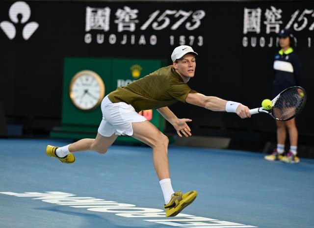 (260126) -- MELBOURNE, Jan. 26, 2026 (Xinhua) -- Jannik Sinner hits a return during the men's singles 4th round match between Luciano Darderi of Italy and Jannik Sinner of Italy at the Australian Open tennis tournament in Melbourne, Australia, Jan. 26, 2026. (Photo by Wang Shen/Xinhua)