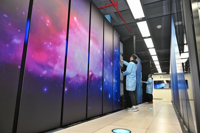 (260126) -- BEIJING, Jan. 26, 2026 (Xinhua) -- Researchers inspect devices at the National Supercomputing Center in Tianfu New Area, southwest China's Sichuan Province, Jan. 10, 2025. The combined economic output of southwest China's Sichuan Province and Chongqing Municipality has exceeded 10 trillion yuan (about 1.44 trillion U.S. dollar) in 2025, accounting for approximately 7.2 percent of the national total. (Xinhua/Liu Kun)