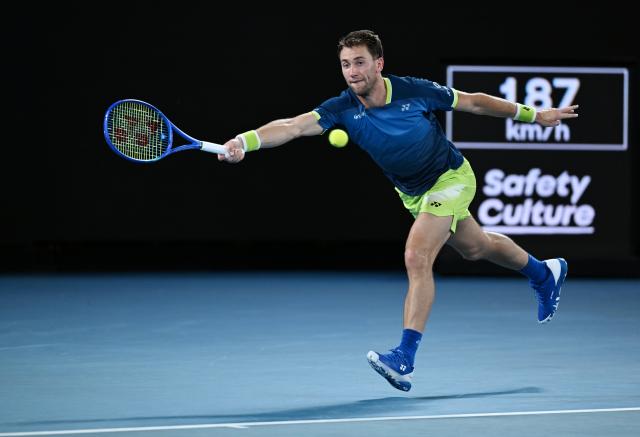 (260126) -- MELBOURNE, Jan. 26, 2026 (Xinhua) -- Casper Ruud hits a return during the men's singles 4th round match between Ben Shelton of the United States and Casper Ruud of Norway at the Australian Open tennis tournament in Melbourne, Australia, Jan. 26, 2026. (Photo by Wang Shen/Xinhua)