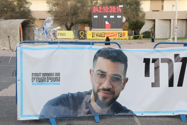 (260126) -- JERUSALEM, Jan. 26, 2026 (Xinhua) -- Photo taken on Jan. 26, 2026 shows a poster of Ran Gvili, the last Israeli hostage whose remains have been found in the Gaza Strip, at a square in Tel Aviv, Israel. The remains of Ran Gvili, the last hostage held in the Gaza Strip, had been identified and taken to Israel for burial, Israeli officials announced on Monday. (Gideon Markowicz/JINI via Xinhua)