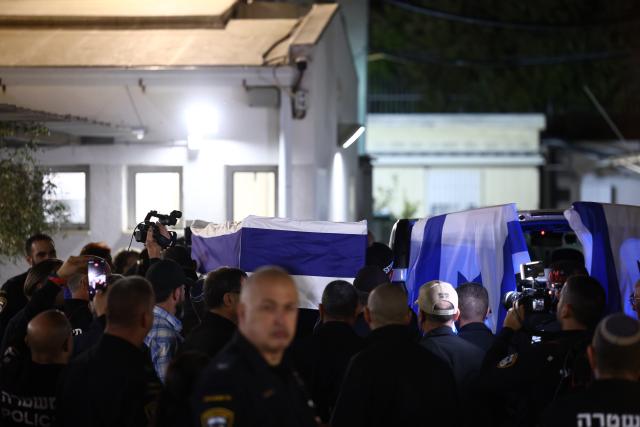 (260126) -- TEL AVIV, Jan. 26, 2026 (Xinhua) -- A coffin containing the remains of Ran Gvili is transported to a forensic institute in Tel Aviv, Israel, Jan. 26, 2026. The remains of Ran Gvili, the last hostage held in the Gaza Strip, had been identified and taken to Israel for burial, Israeli officials announced on Monday. (Photo by Jamal Awad/Xinhua)