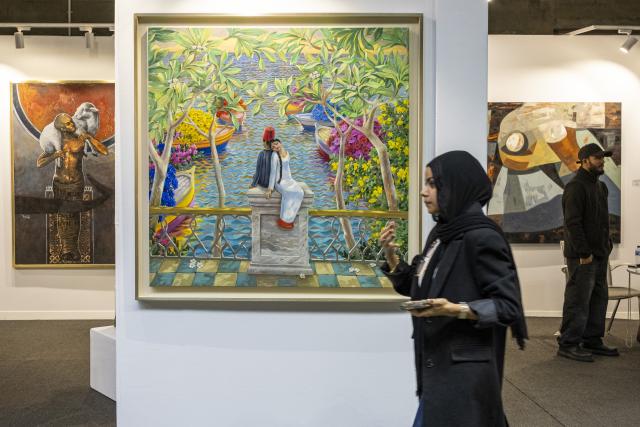 (260126) -- GIZA, Jan. 26, 2026 (Xinhua) -- People visit the Art Cairo at the Grand Egyptian Museum in Giza, Egypt, Jan. 26, 2026. The 7th edition of Art Cairo was held from Jan. 23 to 26, 2026 at the Grand Egyptian Museum. (Xinhua/Xin Mengchen)