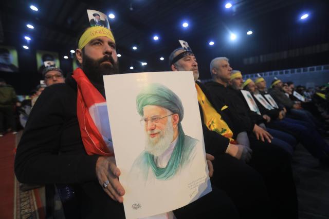 (260126) -- BEIRUT, Jan. 26, 2026 (Xinhua) -- Photo taken on Jan. 26, 2026 shows Hezbollah supporters holding portraits of Iranian Supreme Leader Ali Khamenei during a rally to voice support for Iran and denounce U.S. threats in Beirut, Lebanon. (Photo by Bilal Jawich/Xinhua)
