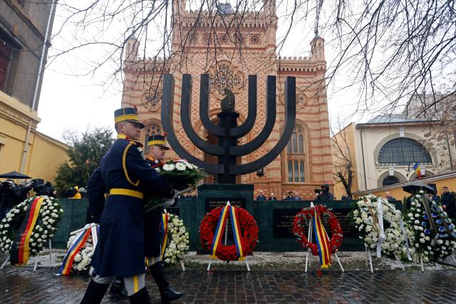 (260127) -- BUCHAREST, Jan. 27, 2026 (Xinhua) -- Soldiers attend a wreath-laying ceremony commemorating Holocaust victims at the Choral Temple on the occasion of International Holocaust Remembrance Day in Bucharest, Romania, on Jan. 26, 2026. January 27 is designated by the United Nations as International Holocaust Remembrance Day, a time to remember the six million Jews who perished in the Holocaust during the Second World War. (Photo by Cristian Cristel/Xinhua)