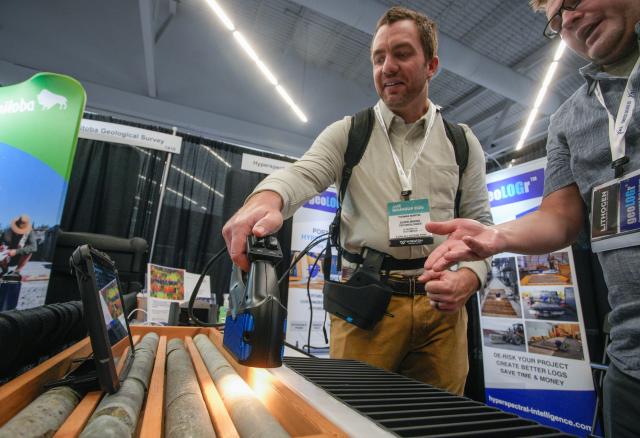 (260127) -- VANCOUVER, Jan. 27, 2026 (Xinhua) -- An attendee tests a rock analyzer during the Association for Mineral Exploration (AME) Roundup 2026 at the Vancouver Convention Centre in Vancouver, British Columbia, Canada, on Jan. 26, 2026. The AME Roundup 2026 kicked off here on Monday, featuring a four-day exhibition with exhibitors from around the world showcasing products, technologies and services related to mineral exploration and development. The event runs from Jan. 26 to Jan. 29. (Photo by Liang Sen/Xinhua)