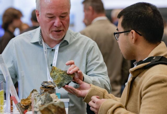 (260127) -- VANCOUVER, Jan. 27, 2026 (Xinhua) -- Attendees view mineral rock samples during the Association for Mineral Exploration (AME) Roundup 2026 at the Vancouver Convention Centre in Vancouver, British Columbia, Canada, on Jan. 26, 2026. The AME Roundup 2026 kicked off here on Monday, featuring a four-day exhibition with exhibitors from around the world showcasing products, technologies and services related to mineral exploration and development. The event runs from Jan. 26 to Jan. 29. (Photo by Liang Sen/Xinhua)