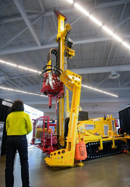 (260127) -- VANCOUVER, Jan. 27, 2026 (Xinhua) -- An attendee looks at a drilling rig during the Association for Mineral Exploration (AME) Roundup 2026 at the Vancouver Convention Centre in Vancouver, British Columbia, Canada, on Jan. 26, 2026. The AME Roundup 2026 kicked off here on Monday, featuring a four-day exhibition with exhibitors from around the world showcasing products, technologies and services related to mineral exploration and development. The event runs from Jan. 26 to Jan. 29. (Photo by Liang Sen/Xinhua)