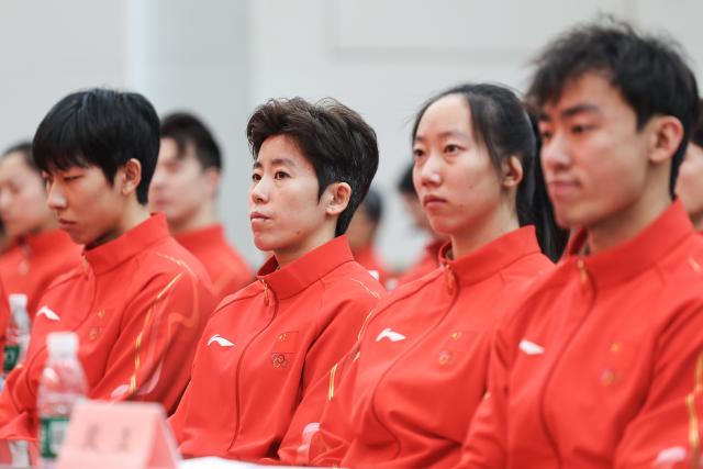(260127) -- BEIJING, Jan. 27, 2026 (Xinhua) -- Short track speed skater Fan Kexin (2nd L) of the Chinese delegation for Milan-Cortina 2026 Olympic Winter Games is seen during the inaugural meeting of the Chinese delegation for Milan-Cortina 2026 Olympic Winter Games in Beijing, capital of China, on Jan. 27, 2026. (Xinhua/Na Yuqi)